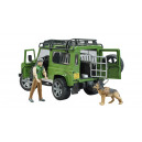 Land Rover Defender Station Wagon avec forestier et chien
